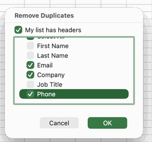 The Remove Duplicates column list with only Email, Company, and Phone checked so Excel matches on those columns.